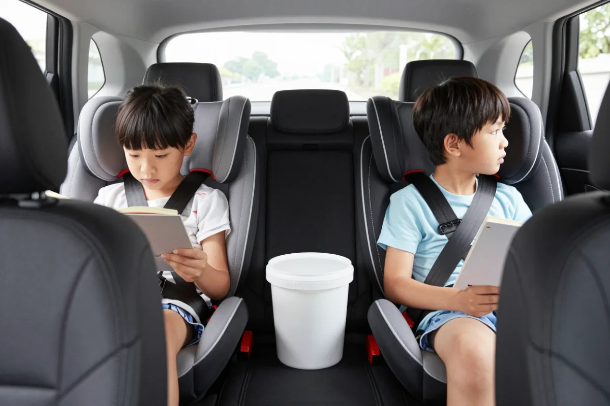 Kids in the back seat during a family trip